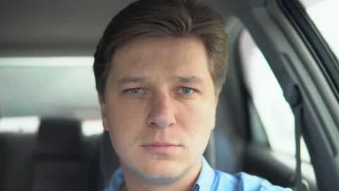 Portrait of a sad man in a car. Stock Footage 81832453