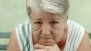 Portrait Of Sad Old Woman With White Hair On Bench Stock Footage