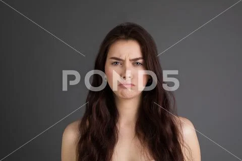 Portrait of saddend girl showing hurt and sadness, looking sad Stock Photos