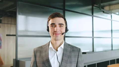 Portrait of Sales agent providing client support in a modern office environment Stock Footage 320910816