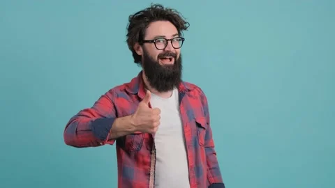 Portrait of satisfied bearded man doing thumbs up gesture. Stock Footage 140265495