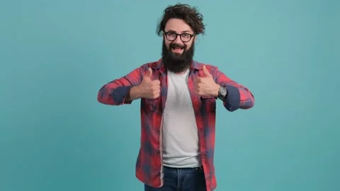 Portrait of satisfied bearded man doing thumbs up gesture. Stock Footage 140393953