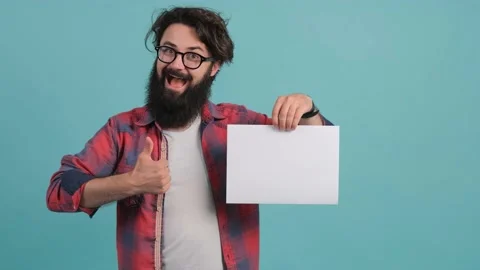 Portrait of satisfied bearded man doing thumbs up gesture with white sheet in Stock Footage 141679501