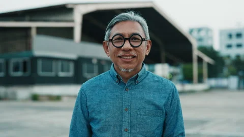 Portrait Of Satisfied Senior Engineer Before Work, Wearing Glasses. Stock Footage 310783768