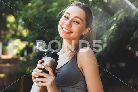 Portrait of a satisfied young fitness girl Stock Photos