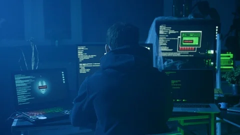 Portrait of scared and obedient computer hacker stealing important data codes on Stock Footage 108818834