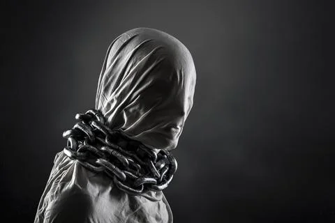 Portrait of a scary ghost with chains over dark misty background Stockfoto's