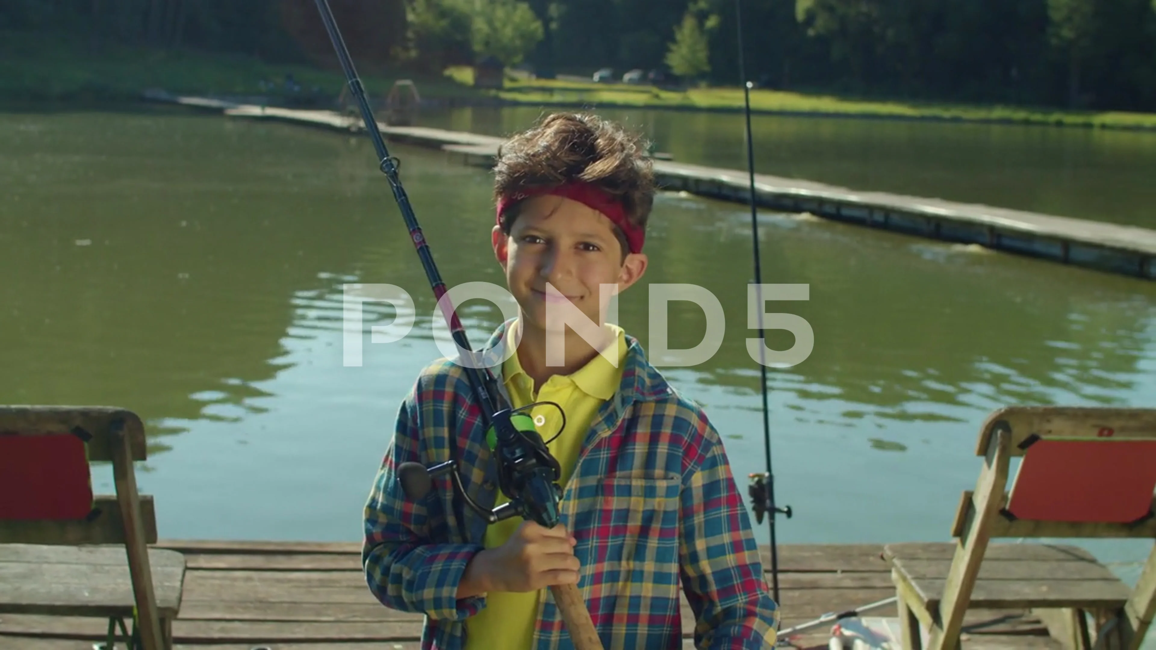 Portrait of school age fisherman boy wit, Stock Video
