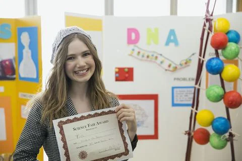 Portrait of school girl with award at science fair Stock Photos