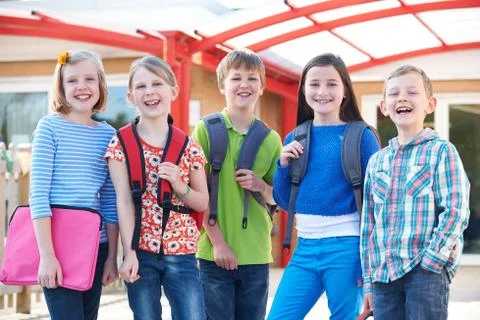 Portrait Of School Pupils Outside Classroom Carrying Bags Stock Photos