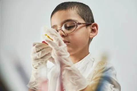 Portrait of schoolboy doing homework Stock Photos
