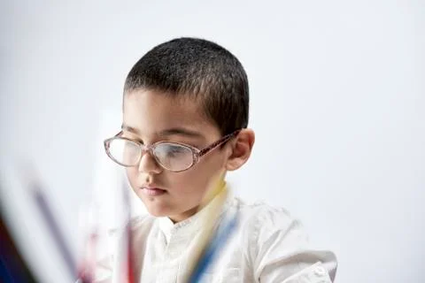 Portrait of schoolboy doing homework Stock-Fotos