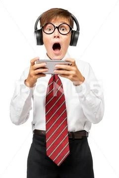 Portrait of a schoolboy playing computer game. Headphones, gadgets. Education Stock Photos