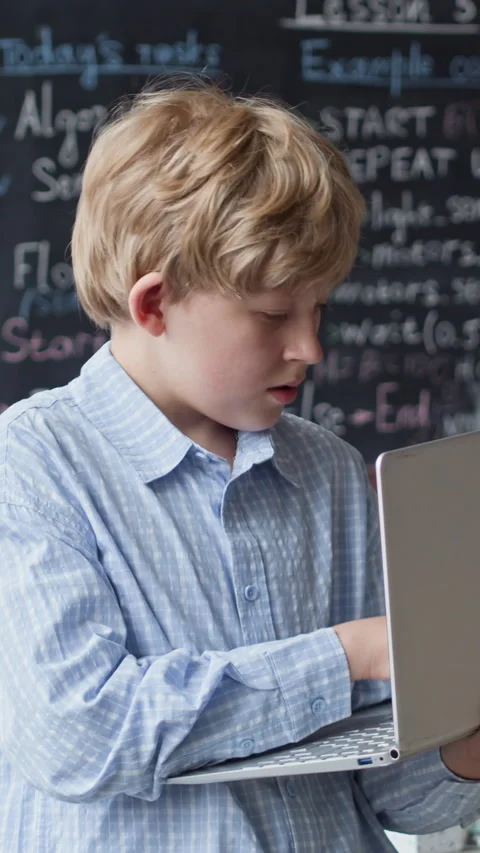 Portrait of Schoolboy Using Laptop in Coding Robotics Lesson Stock Footage 339190572