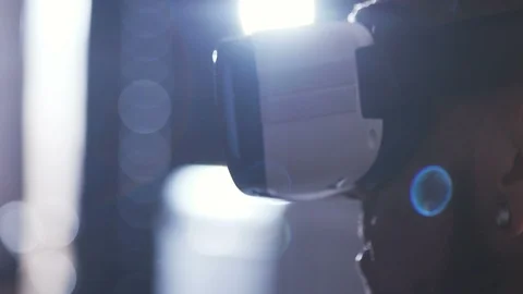 Portrait of scientist using new device. Young man looking around. Space travel Stock Footage 98190050