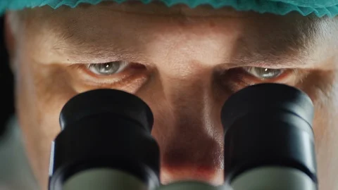 Portrait of a scientist working with a microscope in the lab Stock Footage 126053584