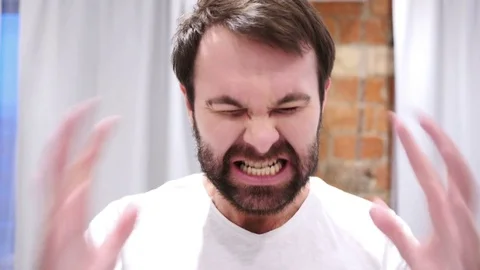 Portrait of Screaming Beard Man going Crazy, Indoor Stock Footage 83150594