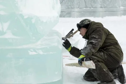 Portrait of a sculptor at work with a chisel 写真素材