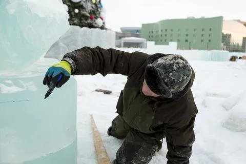 Portrait of a sculptor at work with a chisel Fotos Stock