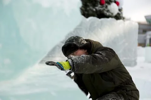 Portrait of a sculptor at work with a chisel 스톡 사진