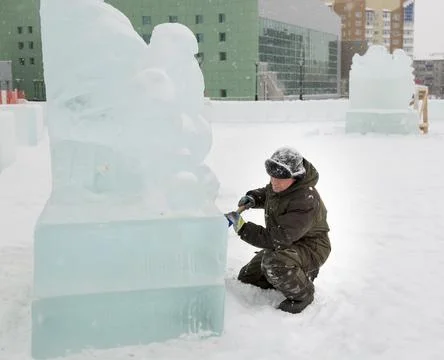Portrait of a sculptor at work with a chisel 写真素材