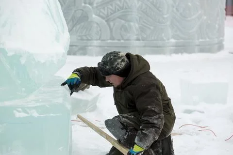 Portrait of a sculptor at work with a chisel Fotos Stock