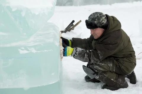 Portrait of a sculptor at work with a chisel 写真素材
