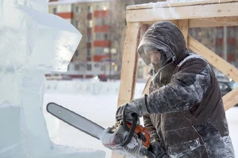 Portrait of a sculptor at work on a figure 스톡 사진