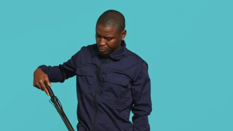 Portrait of security agent removing baton from belt to secure assigned post Stock Footage 278067190