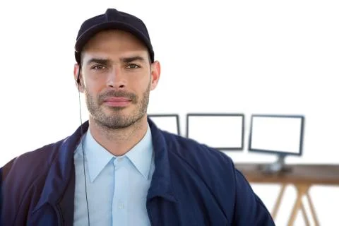 Portrait of security officer with computers in background Stock Photos