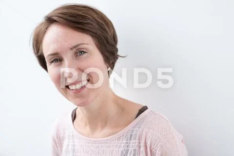 Portrait of self-confident woman in casual clothing style. She smiles broadly Stock Photos