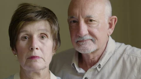 Portrait of a senior aged couple, serious expression Stock Footage