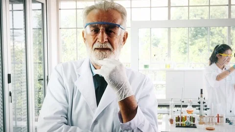 Portrait of senior chemist in front of camera. Stock Footage 99016352