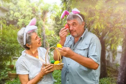 Portrait of a senior couple with Easter eggs Stock Photos