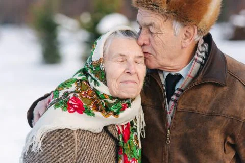 Portrait of senior couple. Elderly man kiss his wife in weighty. old couple Stock Photos