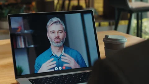 Portrait of senior man with beard greets colleague on video call laptop screen Stock-Footage 310118705