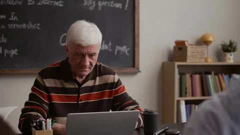 Portrait of Senior Man Focused on ELearning in Classroom Setting Stock Footage 329285755