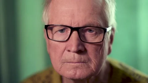 Portrait senior man looking at camera. Footage of a senior man at home. Video stock 135035881