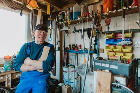 Portrait of Senior Man in Workshop Fotos Stock