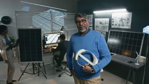 Portrait of Senior Solar Engineer Posing with VR Headset in Hand Stock Footage 307965408