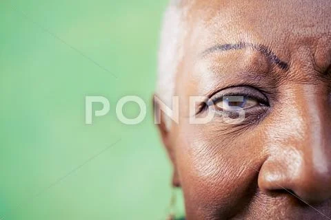 Portrait of senior woman, close-up of eye and face Stock Photos
