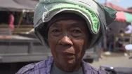 Portrait Of Senior Woman Standing In A Market Stock Footage