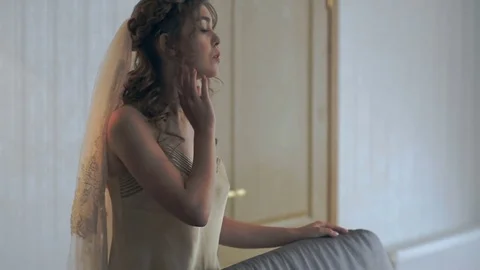 Portrait of a sensual bride. Bride dresses in the morning before the wedding Stock Footage 80481947