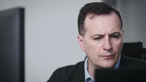 Portrait of a serious and experienced man at the workplace. The manager works Stock Footage 201838515
