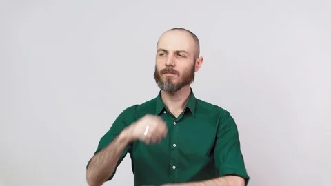Portrait of serious bearded man thinking or remembering, isolated over white Stock Footage 126701405