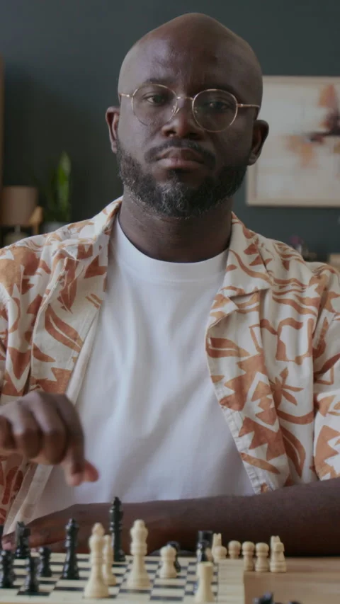 Portrait of Serious Black Man Practicing Chess Skills at Home Stock Footage 291829524