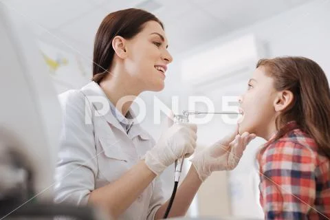 Portrait of serious child sitting with opened mouth Stock Photos