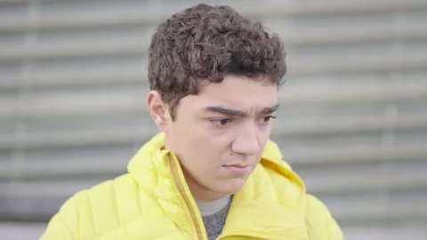 Portrait of serious hispanic boy looking at camera Stock Footage 222574994