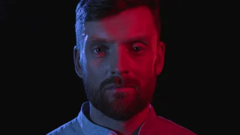 Portrait of Serious Man on Black Background. Face Expression in Colour Filter of Stock-Footage 199478940
