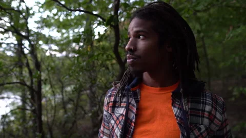 Portrait Serious Man Looking At Camera Then Turning Away to View Forest 스톡 동영상 142013440